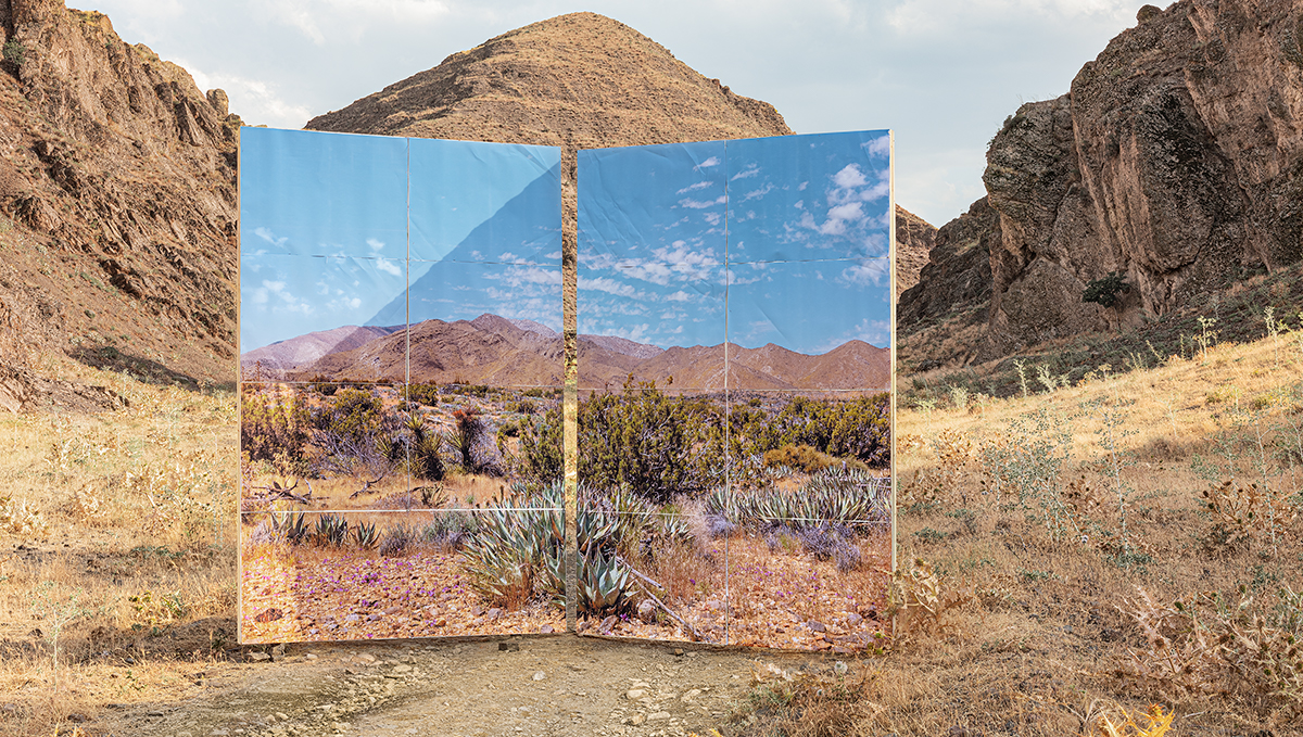 A photo of mountain in a semi-arid landscape set in front of a mountain with similar features.